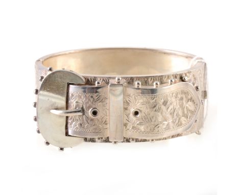 A Victorian silver half hinged bangle, buckle design to front with ivy leaf engraved decoration and bead work, plain back, 25