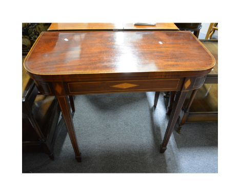 A George III inlaid mahogany card table, rectangular foldover top with rounded corners, and rosewood cross-banding, square ta