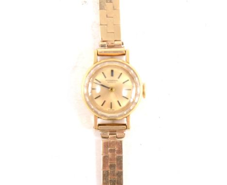 IWC - a lady's bracelet wrist watch, circular champagne baton dial in a 15mm 18 carat yellow gold case with faceted glass, fi