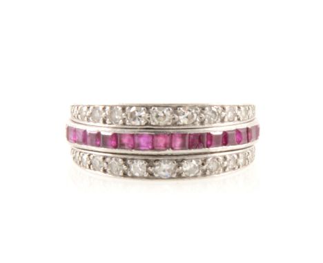 A ruby, sapphire and diamond full eternity ring, "night and day" style, the rubies line edge set to one side and sapphires to