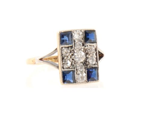 A sapphire and diamond cluster ring in the art deco style, four square sapphires and nine old cut diamonds pave set in a yell
