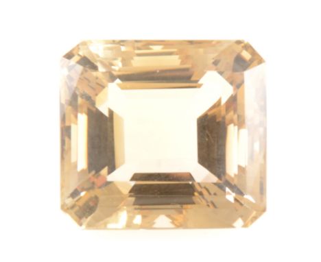 A loose stone - step cut smoky quartz, 32mm x 34mm x 23mm, approx. 165.78 carats.