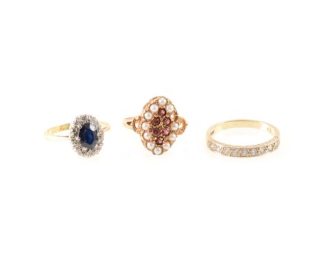 A sapphire and diamond oval cluster ring in a yellow and white metal mount marked 18ct Plat, ring size L, a 9 carat yellow an