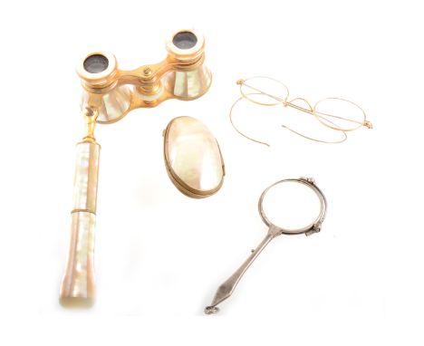 A pair of mother-of-pearl opera glasses with folding handle, painted gauze and lace fan with simulated mother-of-pearl sticks