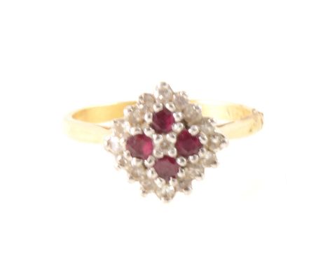 A ruby and diamond cluster ring, four rubies and sixteen brilliant cut diamonds claw set in an 18 carat yellow and white gold