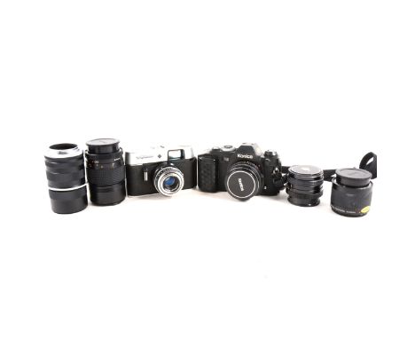 Konica FS-1 SLR camera, with associated lenses, and another camera
