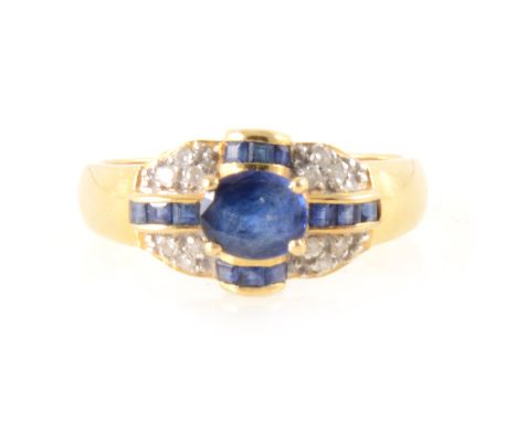 A sapphire and diamond multi stone dress ring, a central oval mixed cut sapphire collet set and surrounded by twelve square c