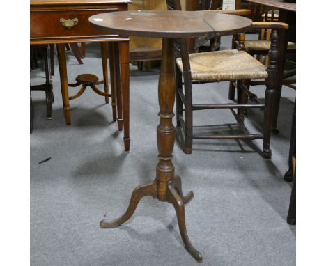 George III oak tripod table, circular fixed top (split), turned column, splayed legs, diameter 50cmx height 76cm.