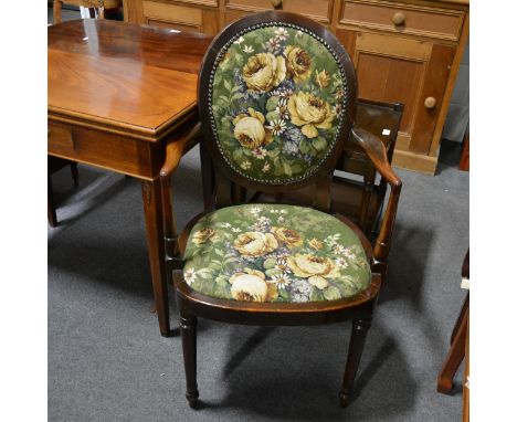 A stained wood elbow chair, later cotton print upholstery to the back and seat, width 55cm. Provenance: By repute from RMS Ma