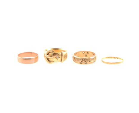 An 18 carat yellow gold 7mm wide buckle ring set with two diamond points, hallmarked London 1919, approximate weight 8gms, ri