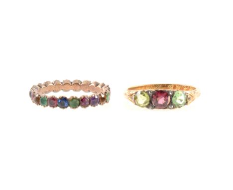 A 3.3mm wide full eternity ring set with emerald, sapphire, ruby, amethyst, citrine, ring size L, and a yellow metal three st