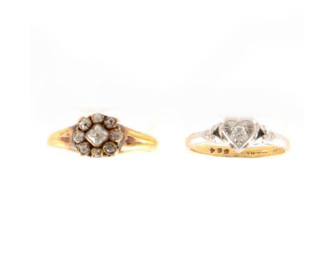 A circular cluster ring claw set with nine various old cut diamonds, the centre stone a cushion shape in a yellow and white m