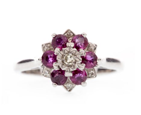 DIAMOND & PINK GEM SET CLUSTER RINGthe snowflake bezel set with a central round diamond surrounded by six round faceted pink 