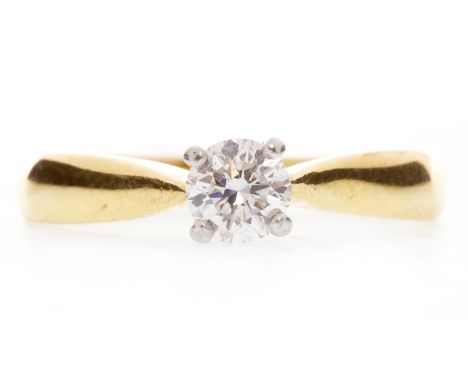 DIAMOND SOLITAIRE RINGwith a four claw round brilliant cut diamond of approximately 0.28 carats, in eighteen carat gold, size