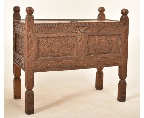 An Indian&nbsp;Damchiya 19th century carved wood Dowry chest trunk on legs. The chest having carved finial to each side surro