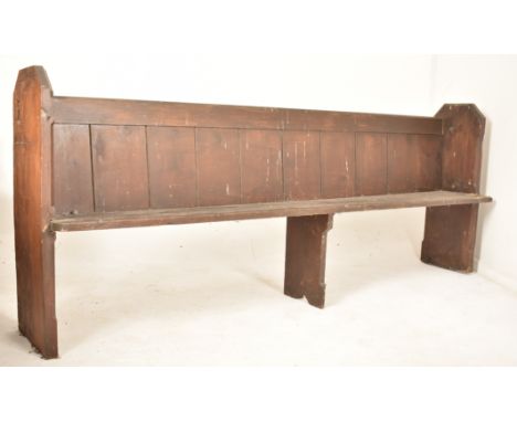 A Victorian 19th century oak ecclesiastic church pew settle bench. The bench having a panelled back rest over straight seat. 