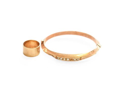 A 9 Carat Gold Band Ring, finger size L1/2 and A Split Pearl Hinged Bangle, inner measurements 5.8cm by 5.1cm (a.f.)9 carat g