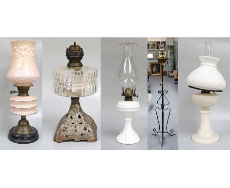 A 19th Century Brass Oil Lamp, on wrought iron stand, together with four other various examples including glass (5)