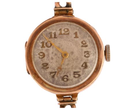 An early 20th century 9ct rose gold mechanical bracelet watch, silvered dial with applied gilt Arabic numerals and 9ct curb l