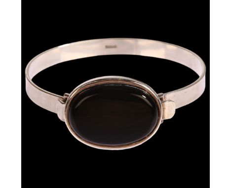 HERMANN SIERSBOL - a Danish modernist sterling silver and black onyx torque bangle, setting height 21.4mm, internal circumfer