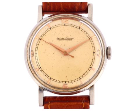 JAEGER LECOULTRE - a Vintage stainless steel mechanical wristwatch, circa 1950s, silvered dial with gilt quarterly Arabic num