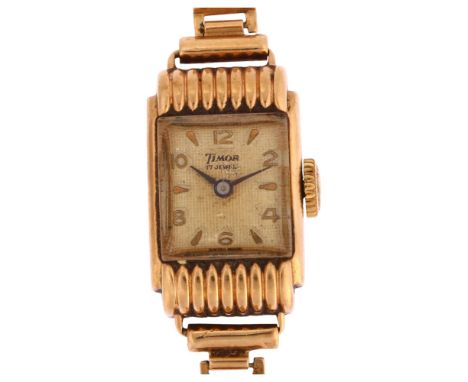 TIMOR - a lady's 9ct gold mechanical wristwatch, textured silvered dial with applied gilt eighthly Arabic numerals and blued 