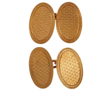 A pair of Art Deco 9ct gold oval cufflinks, with engine turned decoration, London 1927, length 18.2mm, 5.3gNo damage, general
