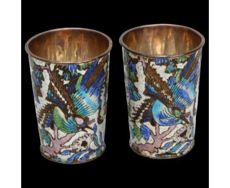 A pair of small Chinese silver and enamel drinking tots, with bird and blossom designs, impressed marks under base, height 4c