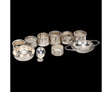 A group of various silver napkin rings, a George III silver caddy spoon, and a plated tea strainer on stand, 6.5oz weighable 