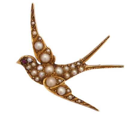 An Edwardian pearl and ruby swallow bird brooch, circa 1905, unmarked gold settings, wingspan 41.3mm, 5.3gNo damage or repair