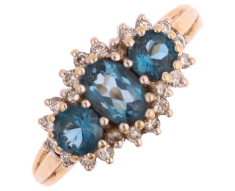 A modern 9ct gold blue topaz and diamond triple cluster ring, setting height 9.6mm, size K, 3.1gNo damage or repair,  all sto