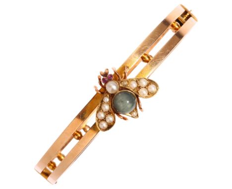 A Victorian figural bee bug hinged bangle, circa 1900, apparently unmarked, set with cats eye chrysoberyl ruby eyes and split