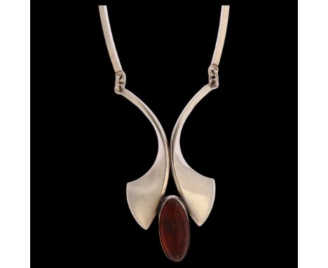 N E FROM - a Danish sterling silver pendant necklace, set with a central amber stone, length 49cmGood condition, light scratc