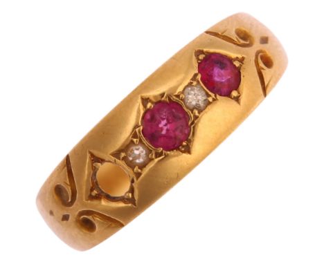 An early 20th century 18ct gold five stone ruby and diamond band ring, setting height 6.6mm, size P, 3.1gNo damage or repair,