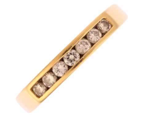 A modern 18ct gold diamond quarter eternity ring, channel set with modern round brilliant-cut diamonds, total diamond content