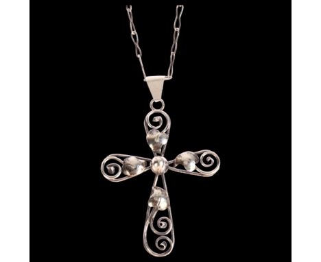 A silver leaf and scroll design cross pendant on silver chain, cross height excluding bale 55mm, 9gGood condition 