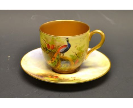 A Royal Worcester coffee can and saucer, signed W H Austen, painted with peacocks, printed marks in puce, early 20th century
