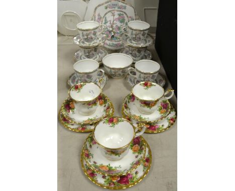 A Royal Stuart Indian tree pattern tea service for six; a set of three Royal Albert Old Country roses trios.