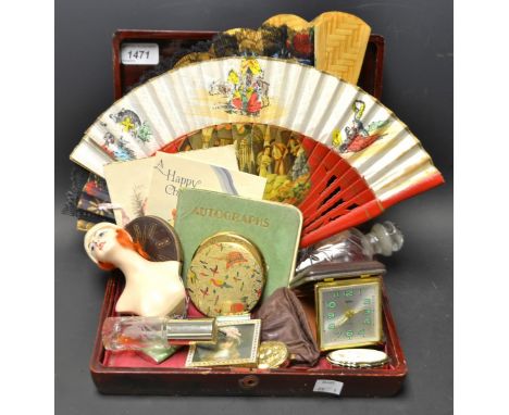 A 1930`s large half doll; compacts; a cheroot; a Coral travel clock; a lady`s pocket enameled lighter; a Oriental lacquered b