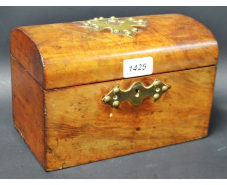 A Victorian neo-Gothic mahogany domed rectangular tea caddy. 