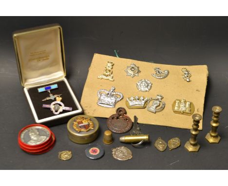 An RAF enamel brooch; commemorative coins and tokens; military badges and pins; qty