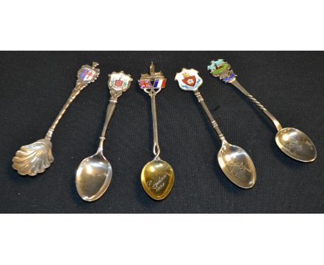 Five silver and enamel teaspoons, including Derby armorial