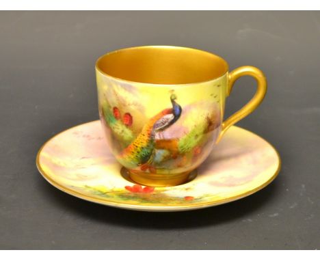 A Royal Worcester coffee can and saucer, signed R Austen, painted with peacocks, printed marks in puce, early 20th century
