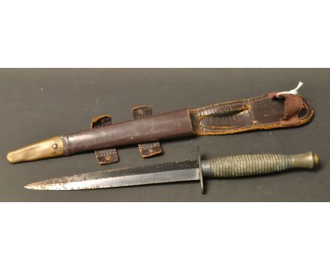 A Fairbairn Sykes commando knife and scabbard