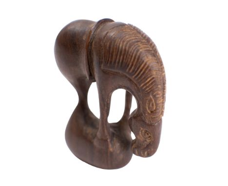 A Japanese boxwood netsuke of a grazing horse, signed, 4.5cm high.