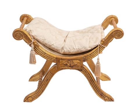 A Continental carved and giltwood 'X' frame stool in Louis XVI taste, 20th century; with damask style fabric cushion and dish