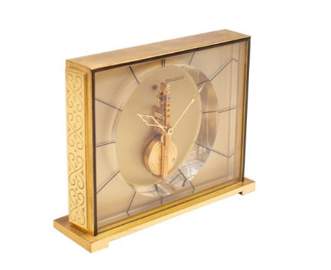 Jaeger-LeCoultre a gilt-brass and lucite Baguette desk clock,  having an eight-day duration jewelled in-line skeletonised tim