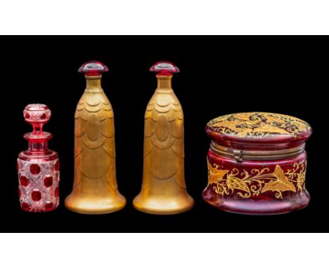 A small group of Continental glass, comprising a small ruby flashed cut glass scent bottle and stopper, a pair of moulded gil