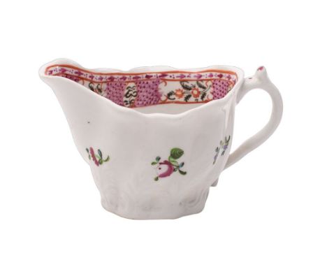 A Caughley creamboat of Low-Chelsea ewer type painted in the Chinese export style with flower sprays and a pink lattice borde