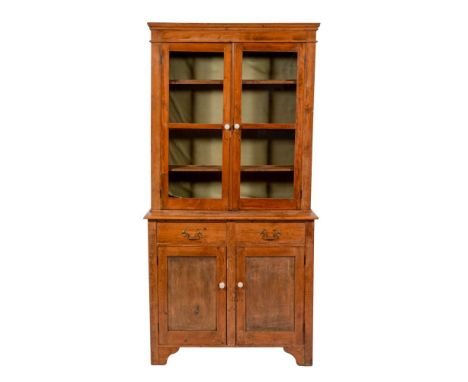 A Victorian pine and glazed display cabinet, late 19th century; the upper section with moulded cornice and blank frieze, abov